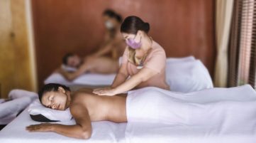 Couple men and women getting a Thai massage
